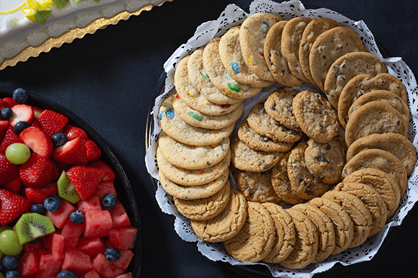 Delicious Bakery Trays featuring cookies and fresh fruit