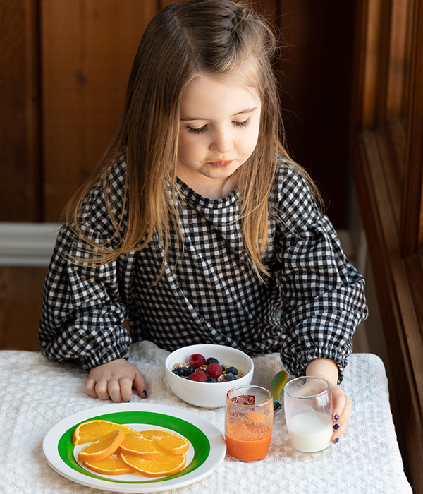 Little Girl Eating Morning Oats