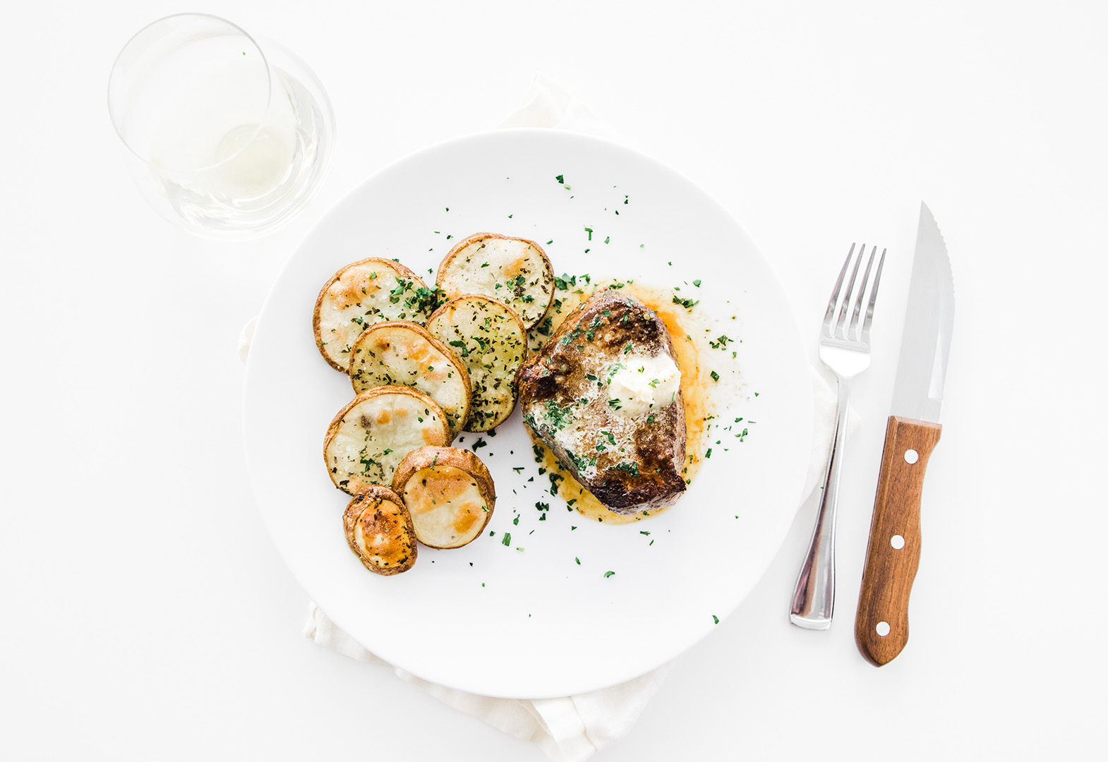 Pan-Seared Strip Filet with Lemon Butter and Herb Potatoes