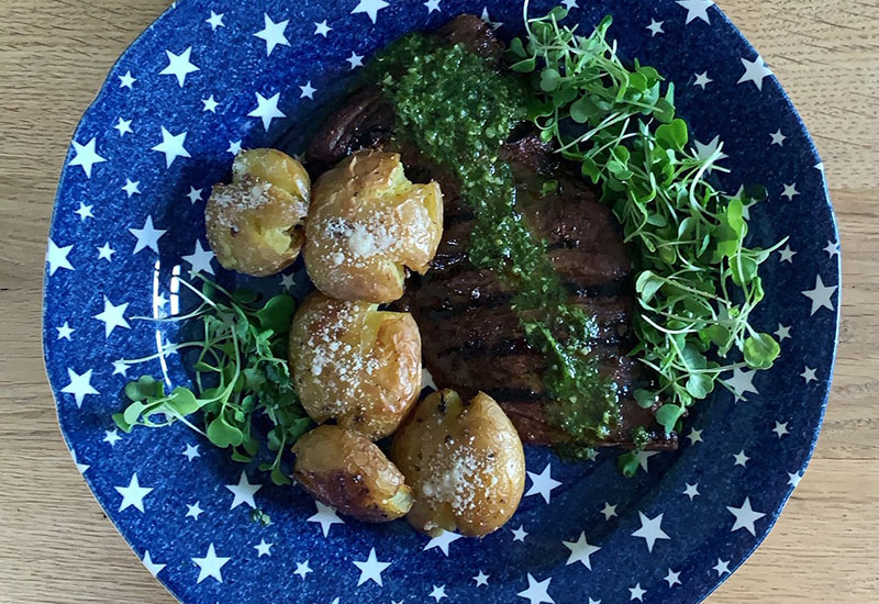 Grilled Skirt Steak with Smashed Potatoes and Chimichurri