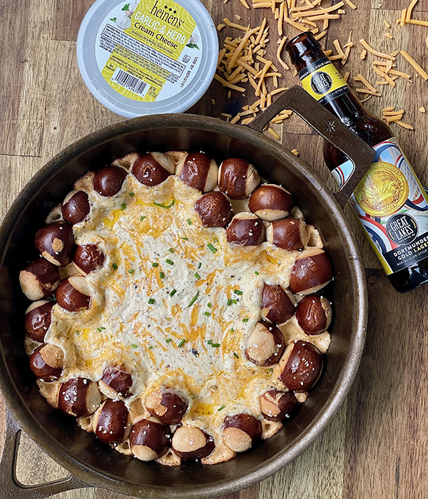 Pretzel Skillet Dip with Heinen's Cream Cheese Container and Beer Bottle