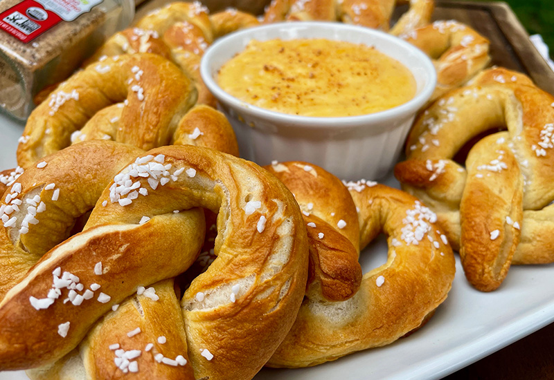 Baked Soft Pretzels with Cheddar Sauce