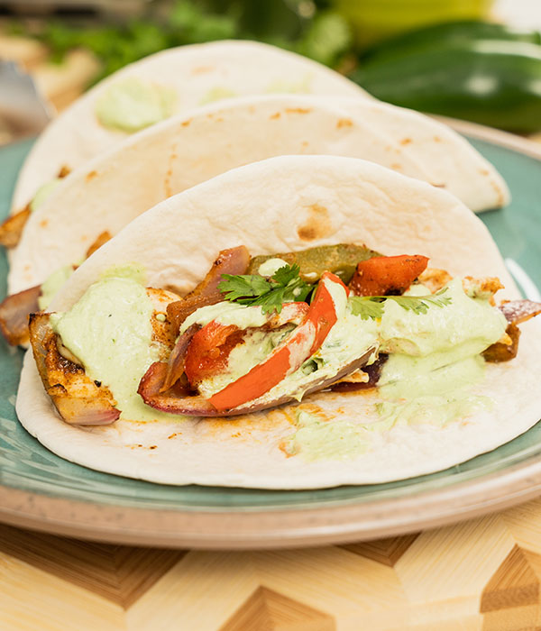 Sheet Pan Chicken Fajitas with Cilantro Lime Crema