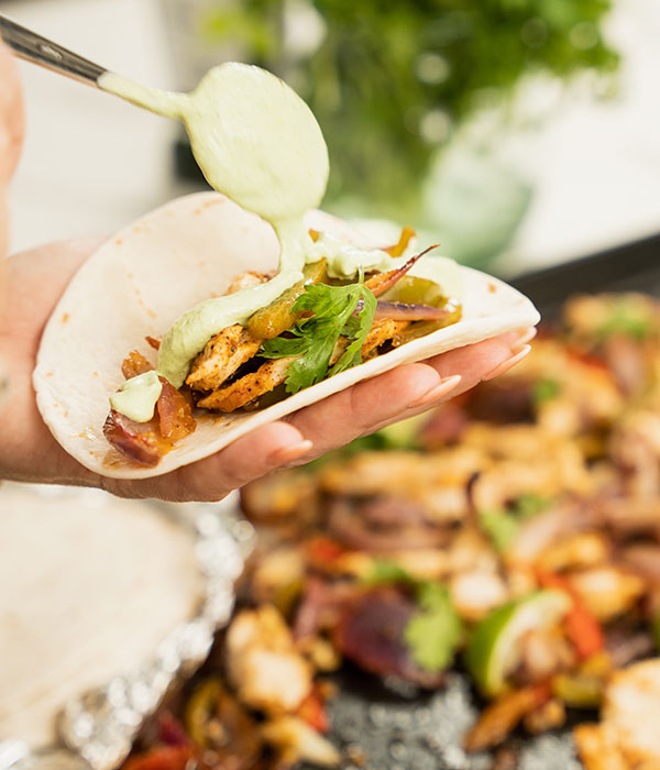 Sheet Pan Chicken Fajitas with Cilantro Lime Crema