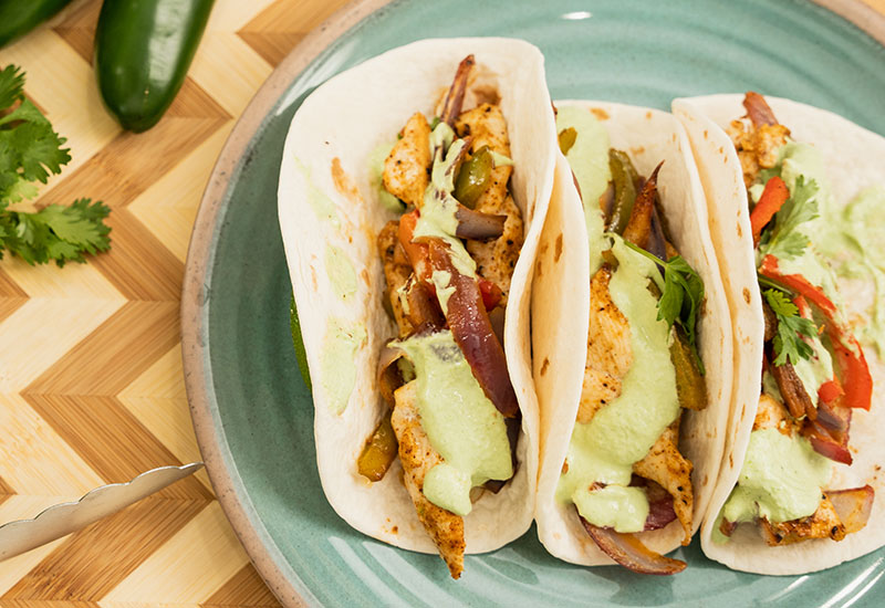 Sheet Pan Chicken Fajitas with Cilantro Lime Crema