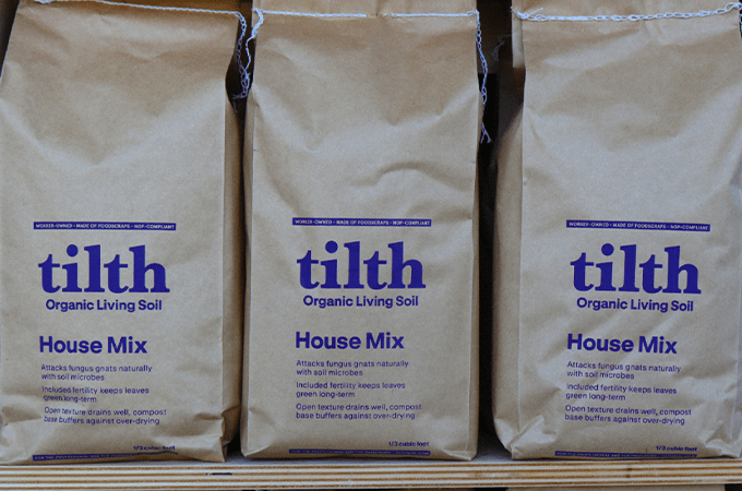 3 tith soil bags on a shelf
