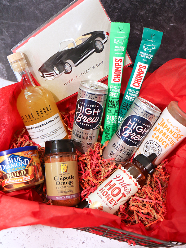 Father's Day gift basket with beef sticks, chipotle orange seasoning, barbecue sauce, cold brew coffee, flavored almonds, margarita mix, and hot honey.