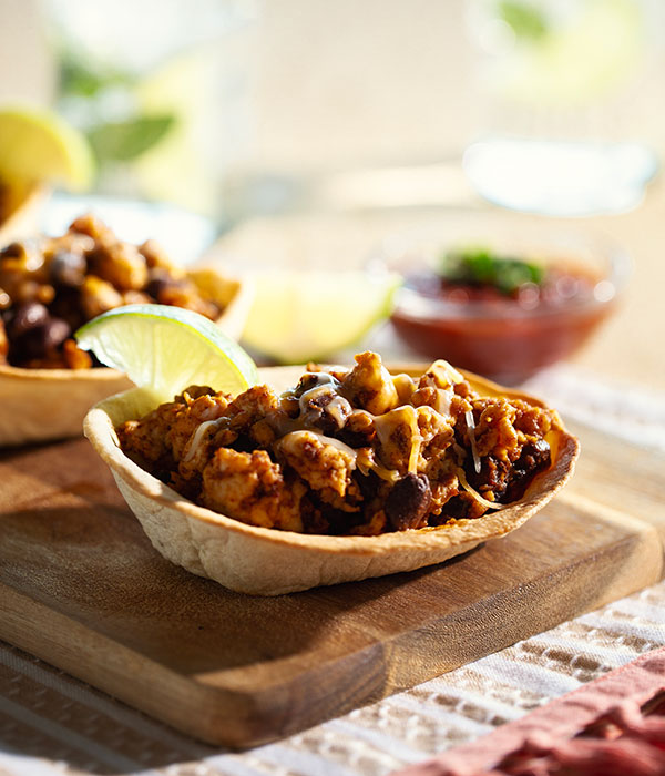 Chicken Burrito Bowls on a Countertop with a Slice of Lime