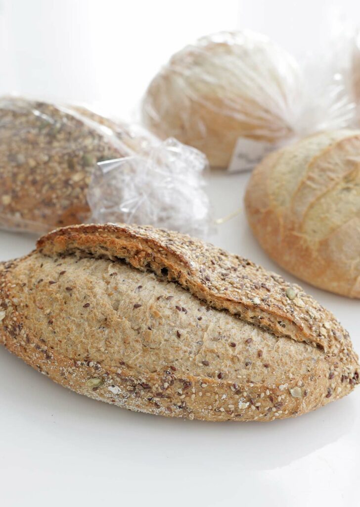 Loaves of multigrain and sourdough breads.
