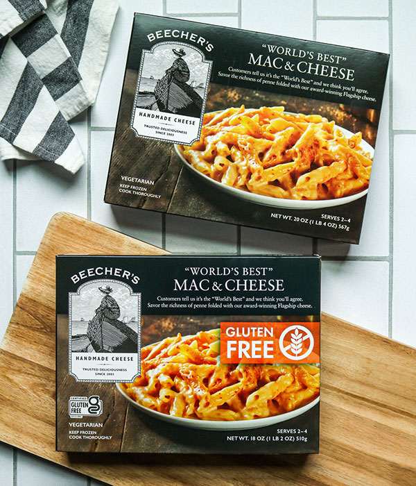 Beecher's Frozen Mac and Cheese on Tile Surface with a Wood Cutting Board and Striped Dish Towel