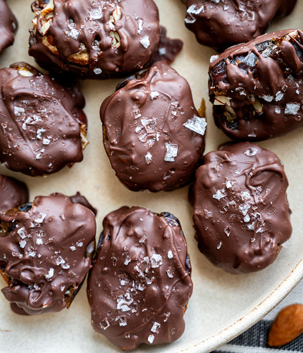 Close up of Mini Chocolate Covered Dates Snickers Bars on a Plate