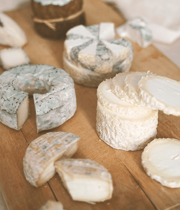 An Assortment of Goat Cheeses on a Board