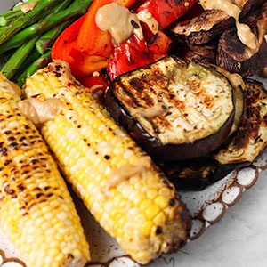 A Plate of Fresh Grilled Vegetables with Tahini Dressing