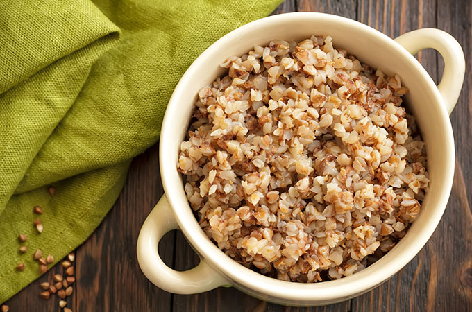 A Bowl of Buckwheat Cereal with a Green Napkin