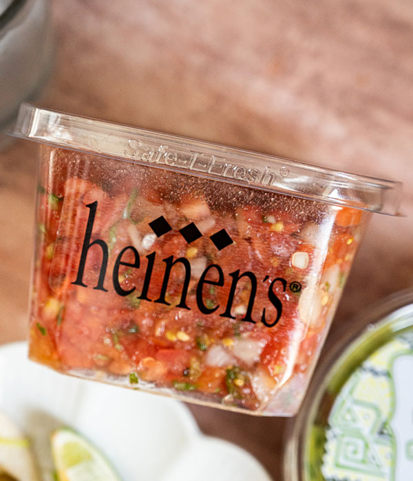 A Side Angle Image of Heinen's Fresh Pico de Gallo in it's Container