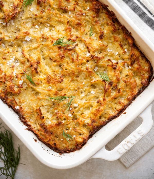 close up of Potato Kugel in white baking dish