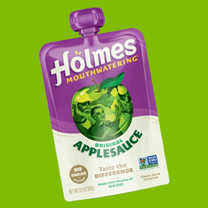 A Pouch of Holme's Apple Sauce on a Vibrant Green Background.