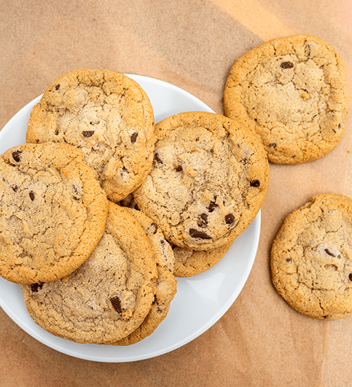 Heinen's All Butter Chocolate Chip Cookies on a Plate with Brown Butcher Paper