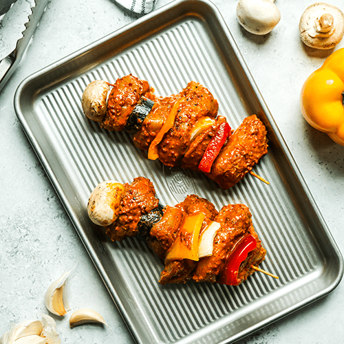 Heinen's Garlic Pepper Marinated Chicken Kabobs on a Metal Sheet Pan