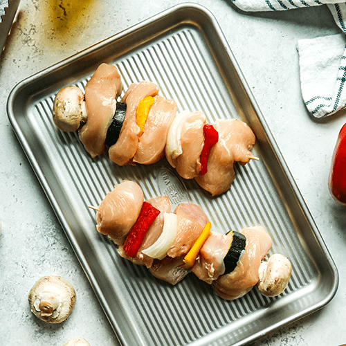Heinen's Raw Chicken Kabobs on a Metal Sheet Pan