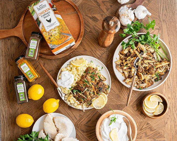 Plate of Chicken Shawarama next to ingredients and side options for the recipe.