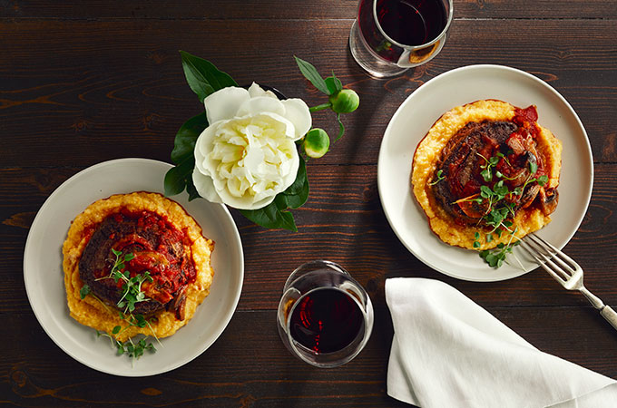Two plates of stuffed flank steak arrabiatta