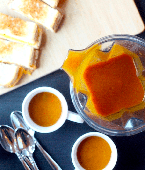 Creamy Tomato Soup in a Blender and Small Serving Bowls