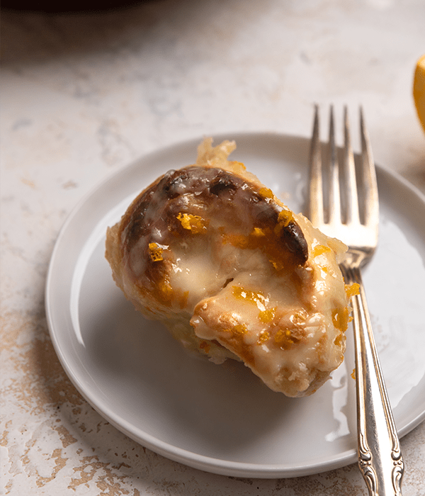 a cut piece of shortcut orange roll