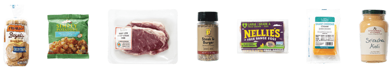 Steak, Egg and Cheese Bagel ingredients: Beef Thin Sliced Strip Steak, Thomas' Everything Bagels, Nellies Eggs, Brown, Free Range, Large, Heinen's Sliced Sharp Cheddar Cheese, Two Brothers Steak & Burger Seasoning, Stonewall Kitchen Aioli, Sriracha, Simply Potatoes Diced Potatoes with Onions.