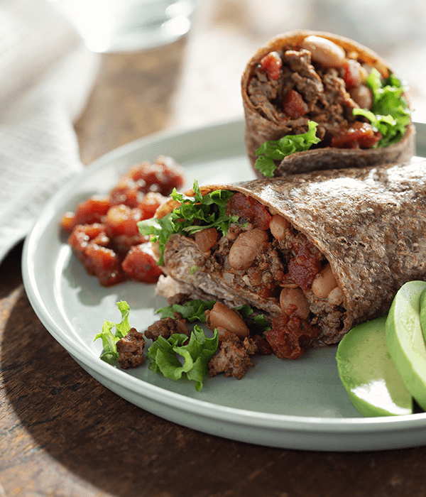 loaded burrito plated with garnishes