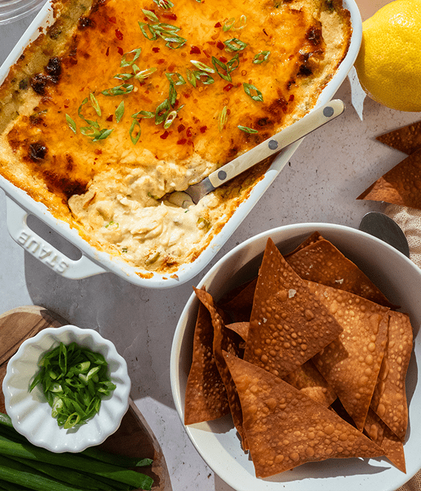 Crab Rangoon Dip and Baked Wonton Chips served with fresh lemon and green onion