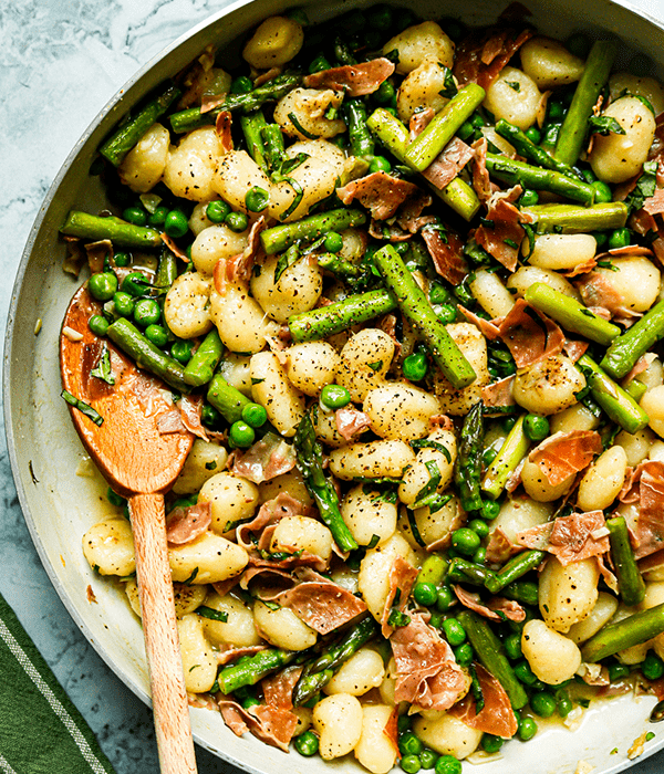 Gnocchi with Peas and Prosciutto in a pan, ready to be served