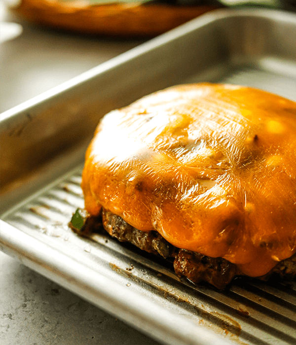 Heinen's Jalapeno Blitz Burger with some melted Great Lakes sharp cheddar cheese over it