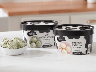 Heinen's Ice Creams flavors: French Vanilla and Mint Chocolate Chip in their boxes next to a bowl of some of the mint chocolate chip