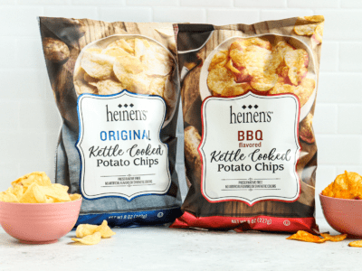 Heinen's original and bbq chips in the bags next to some of the chips in bowls.