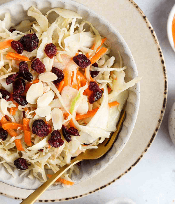 Mayo- Free Coleslaw plated with a fork