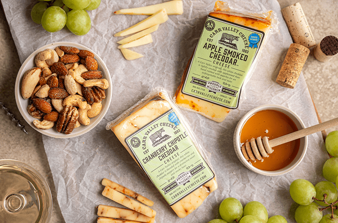 Heinen's selection of Carr Valley Cheeses laid out on a table surrounded by snacking parings