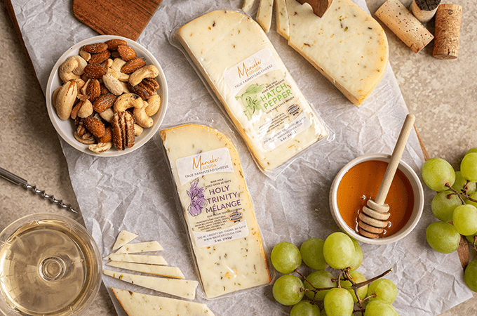 Heinen's selection of Marieke Cheeses laid out on a table surrounded by snacking parings