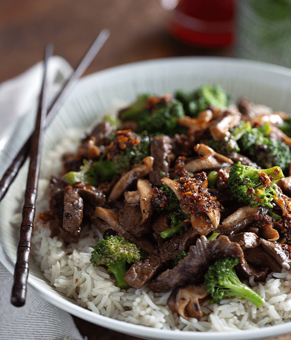 BEEF & BROCCOLI STIR FRY served with white rice and chop sticks