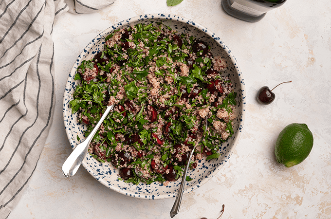 Cherry Quinoa Salad plated with silver wear