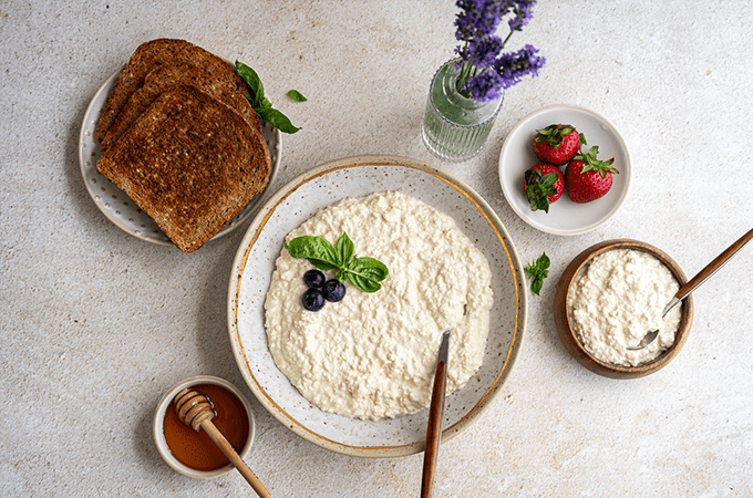 Vegan Tofu “Cottage Cheese” in a bowl with a serving spoon