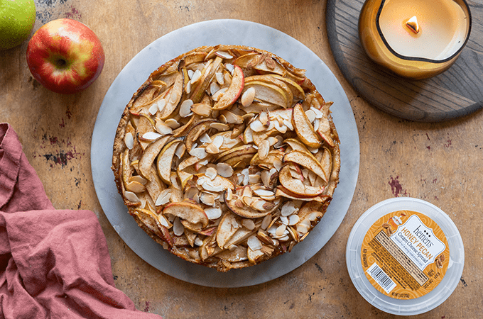 Bavarian Apple Torte freshly baked non-sliced on a grey plate