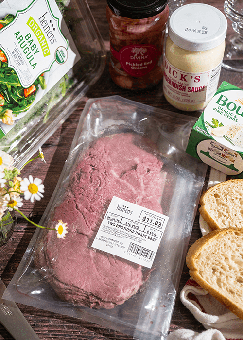 Yoko's Roast Beef & Arugula Sandwich ingredients laid out on a wooden cutting board