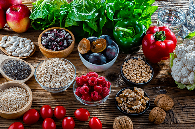 3 Fiber-Rich Meal Plans to Support Your Health - an assortment of healthy fiber rich foods on a wooden table