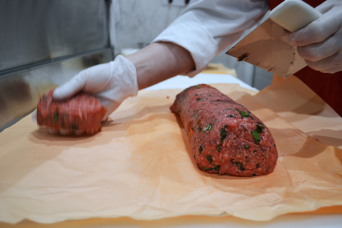Raw Gourmet Burgers being Hand Formed