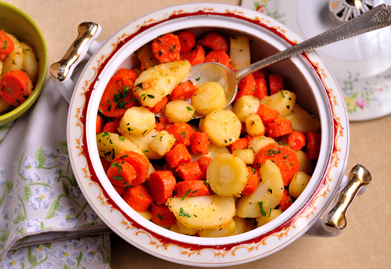 Glazed carrots and parsnips in a bowl