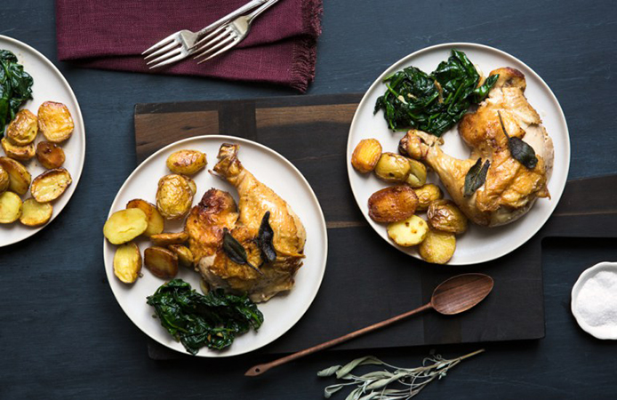 Crispy chicken thighs with garlic spinach and roasted potatoes