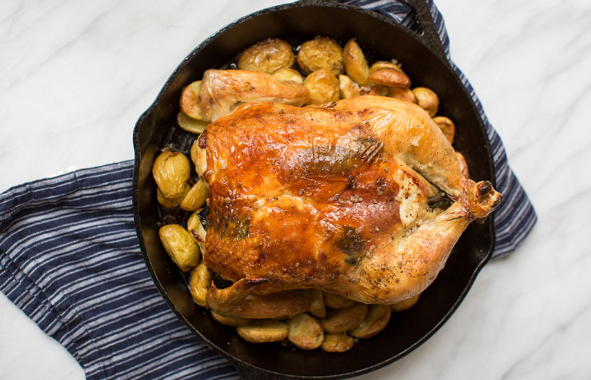 Roasted Whole Chicken over Potatoes