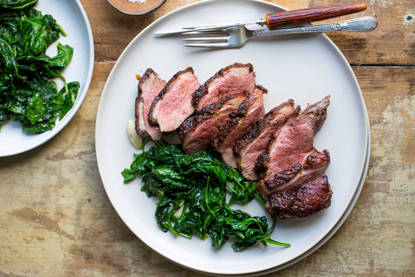 Duck and wilted spinach