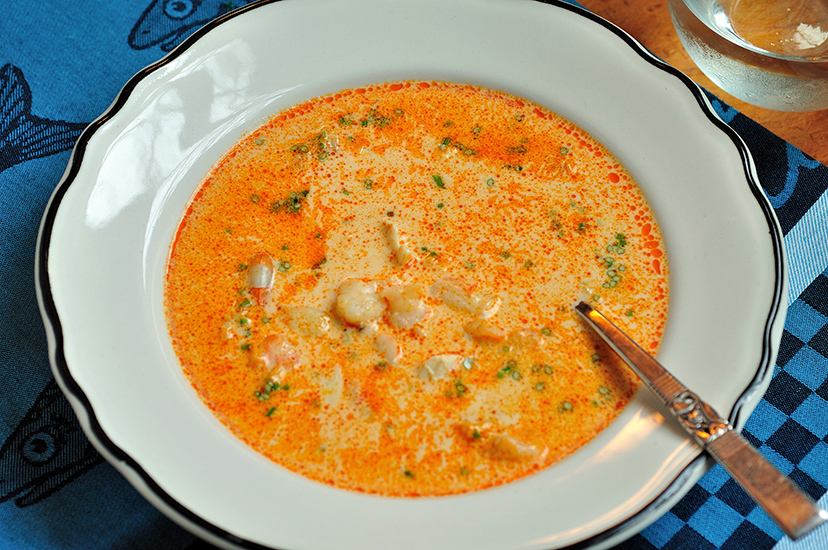 Crab soup in a white bowl